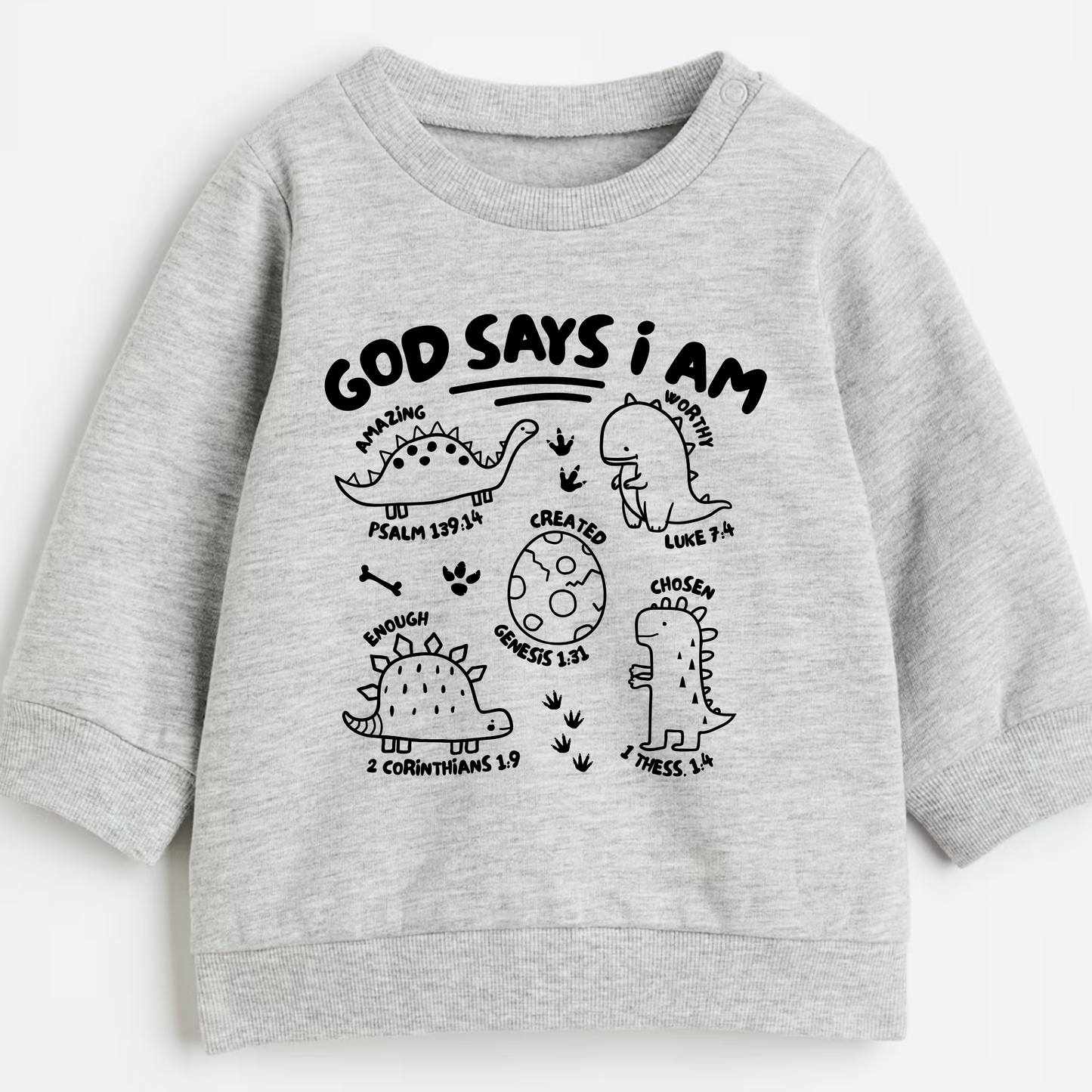 Gray sweatshirt with black dinosaur illustrations and faith based text on a white background
