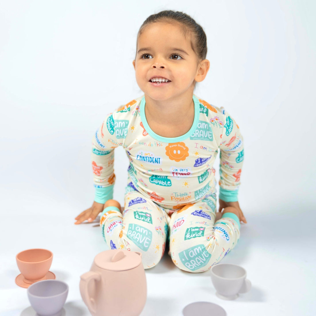 Child wearing Positive Affirmations bamboo two piece pajama set with I am brave print