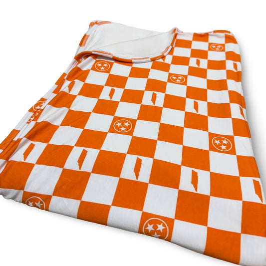Orange and white checkered blanket with logos on a white background