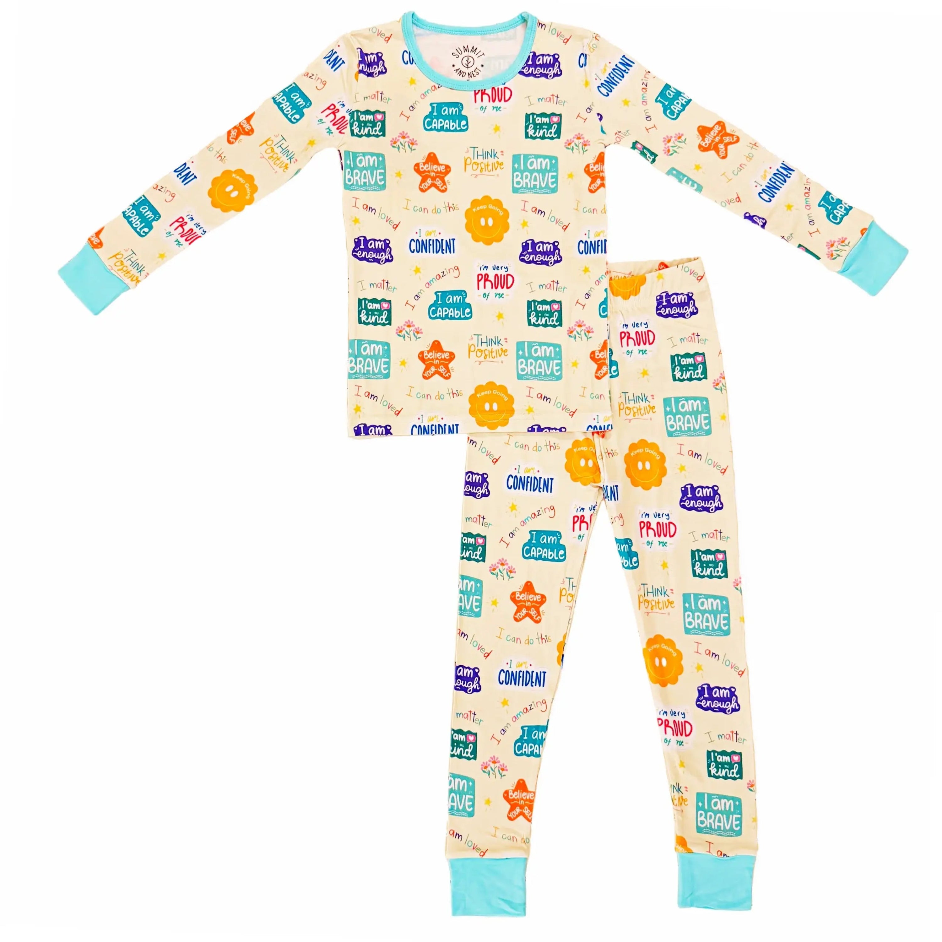 Children's pajama set with colorful positive affirmations text and graphics on a white background