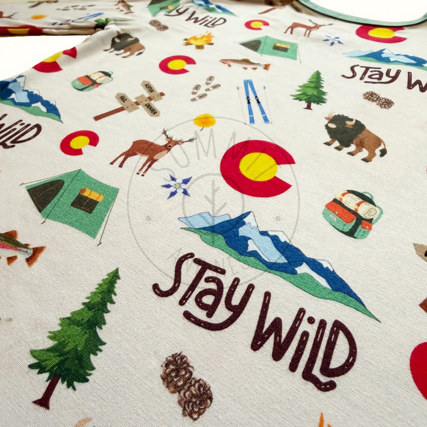 Colorado -themed fabric with 'Stay Wild' text and nature illustrations.