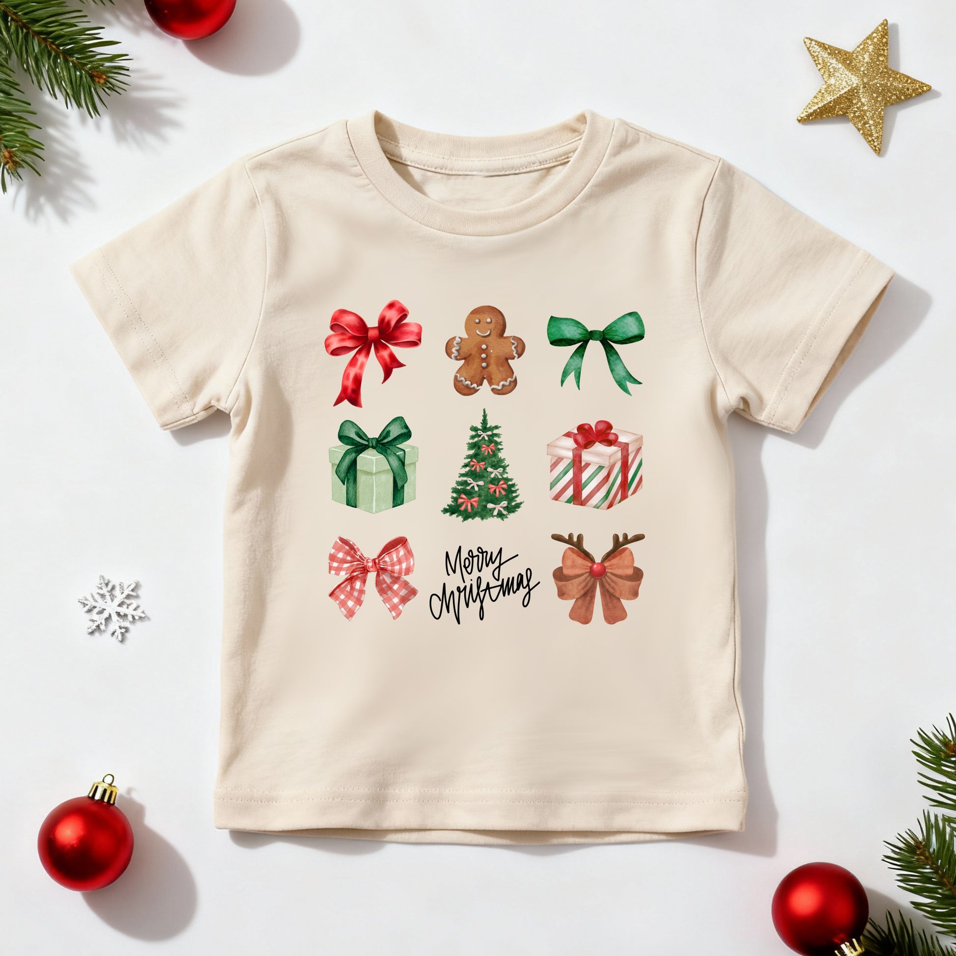 Beige t-shirt with Christmas-themed graphics on a white background