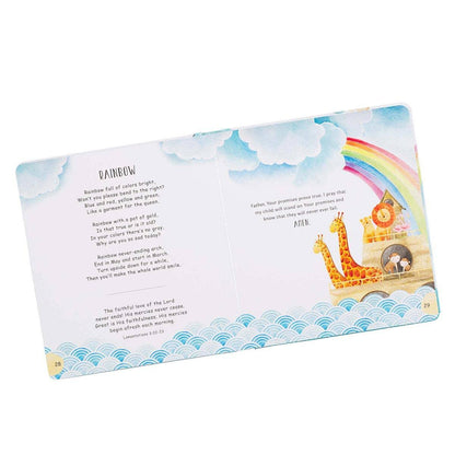 Children's book open to a page with a rainbow and Noah's Ark illustration on a white background