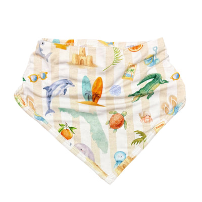 Baby bib with beach-themed design on a white background