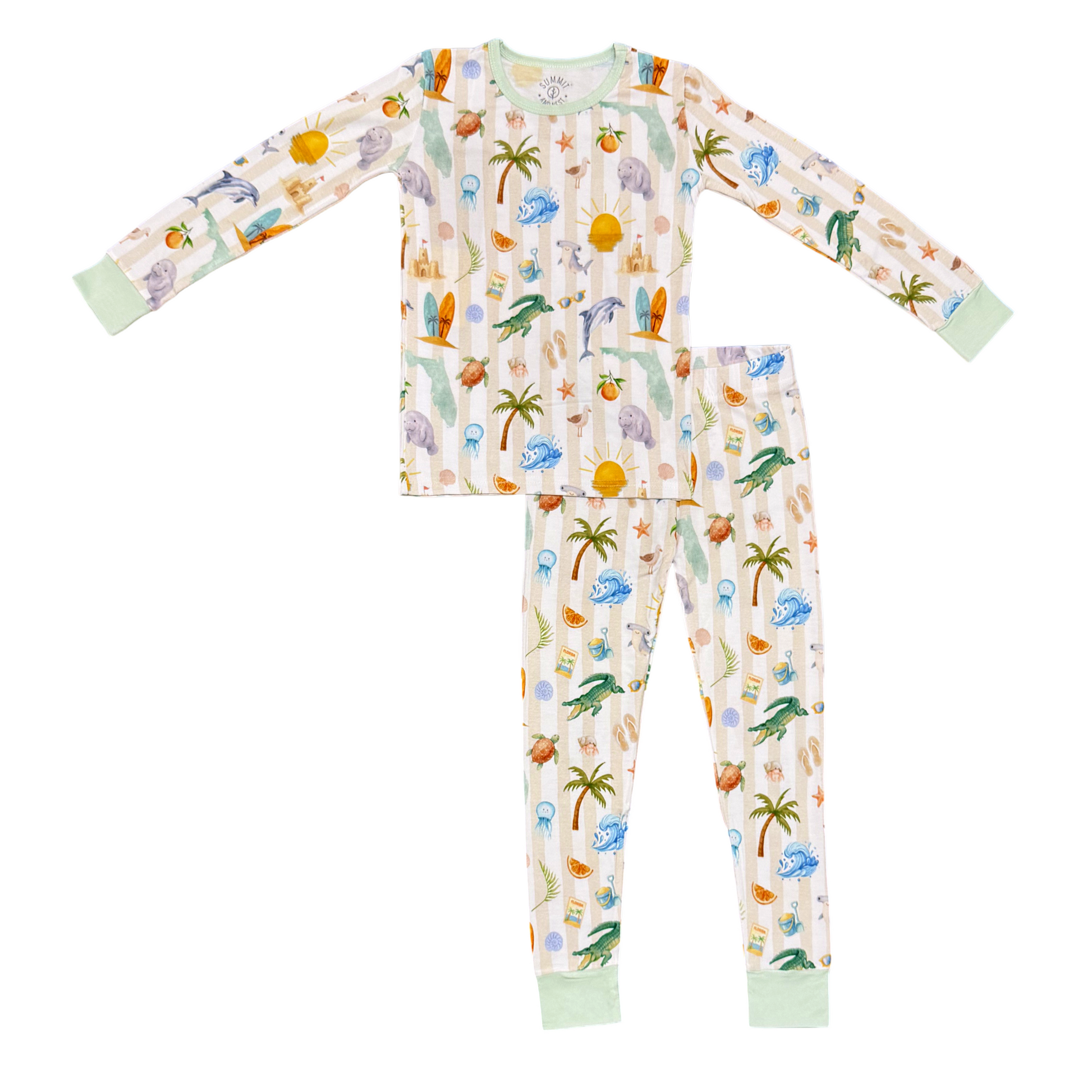 Children's pajama set with a tropical Florida pattern on a white background