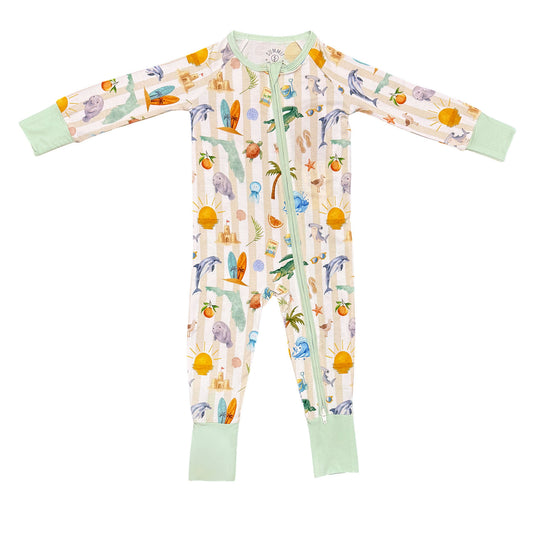 Baby onesie with tropical fruit and animal pattern on a white background