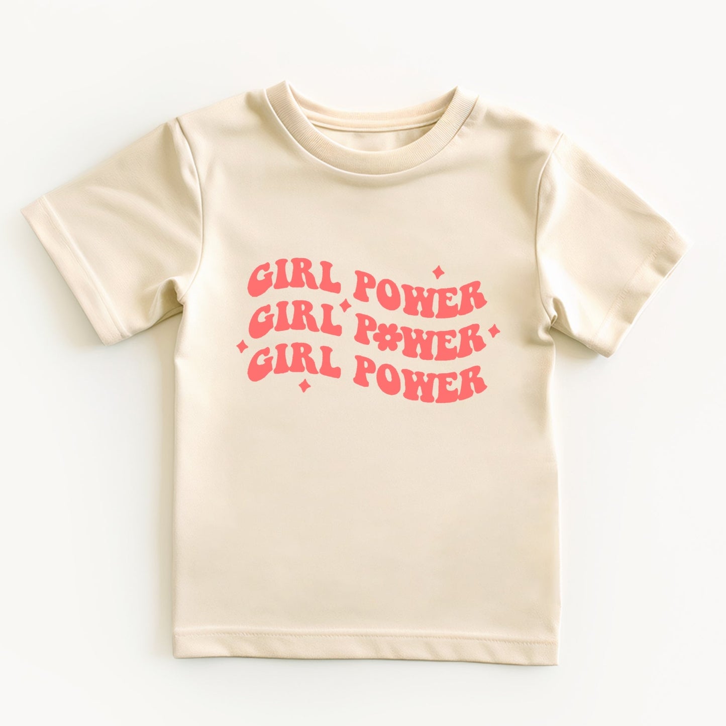 Beige t-shirt with 'Girl Power' text in pink on a white background