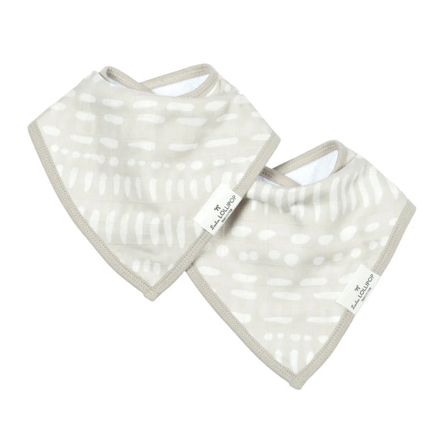 Two baby bibs with a subtle pattern on a white background
