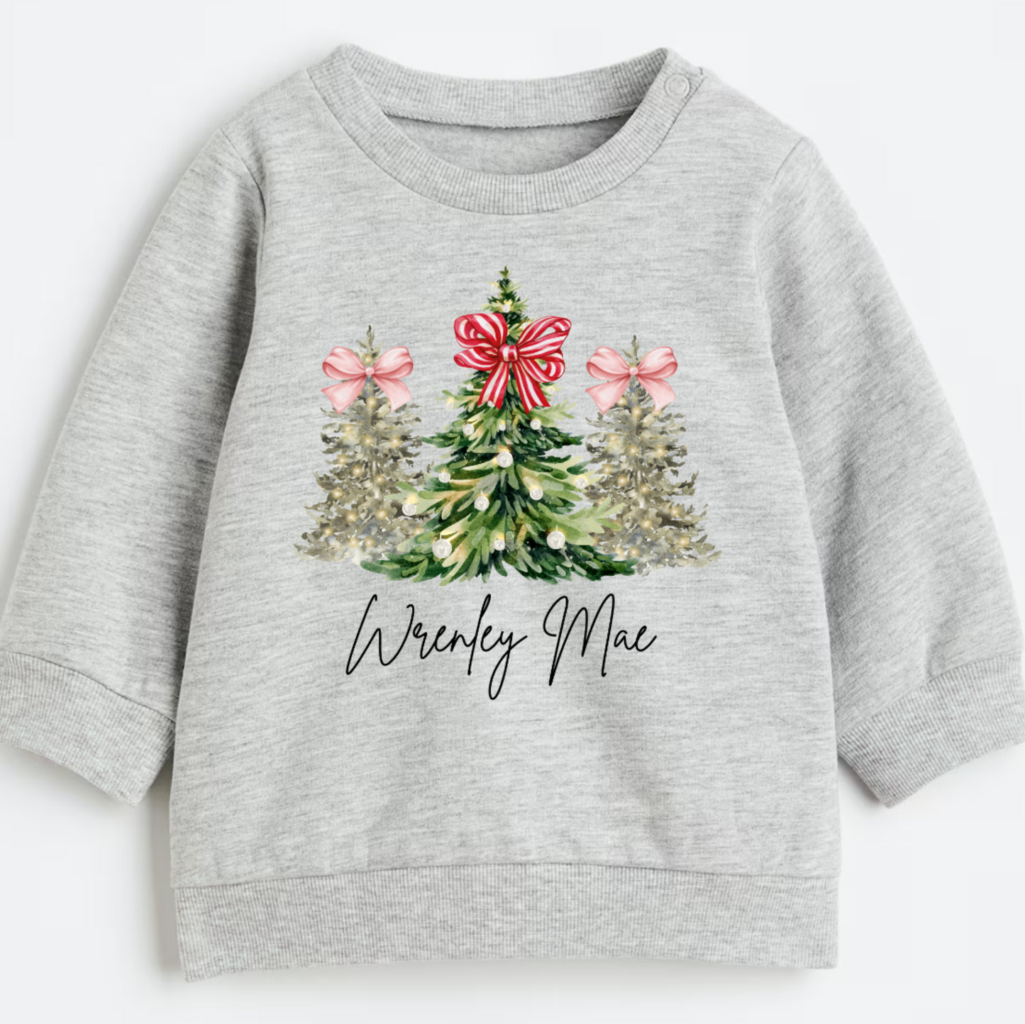 Gray sweatshirt with Christmas tree design and 'Wrenley Mae' text on a white background