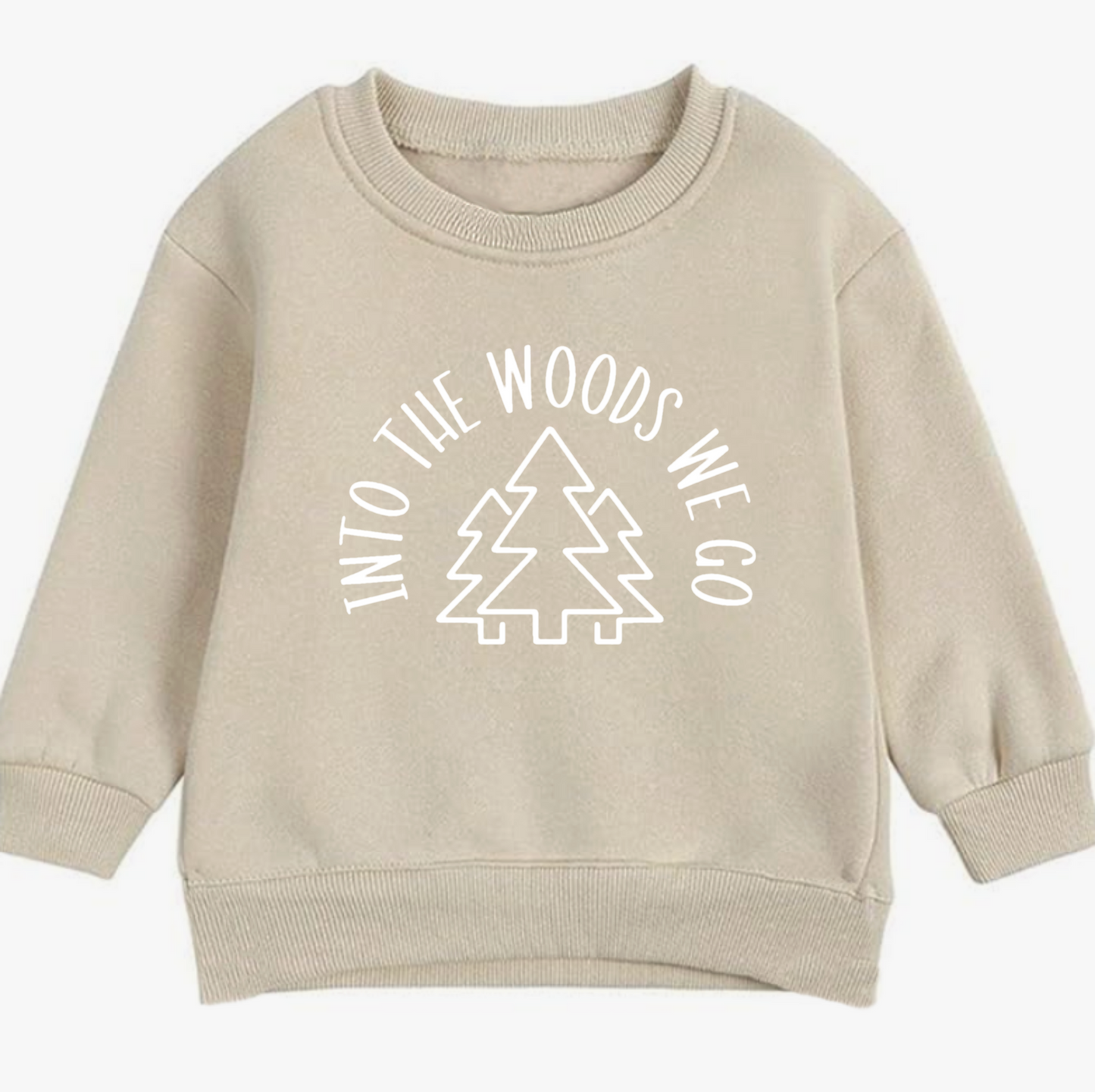 Beige sweatshirt with 'Into the Woods We Go' text and tree graphic on a white background