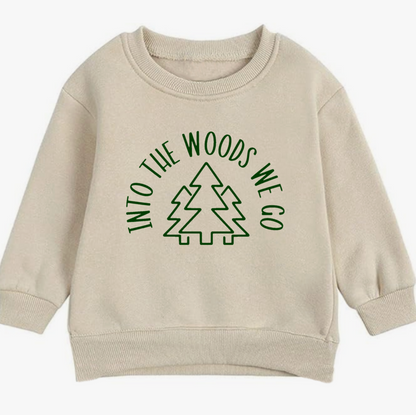 Beige sweatshirt with green text and tree graphic on a white background
