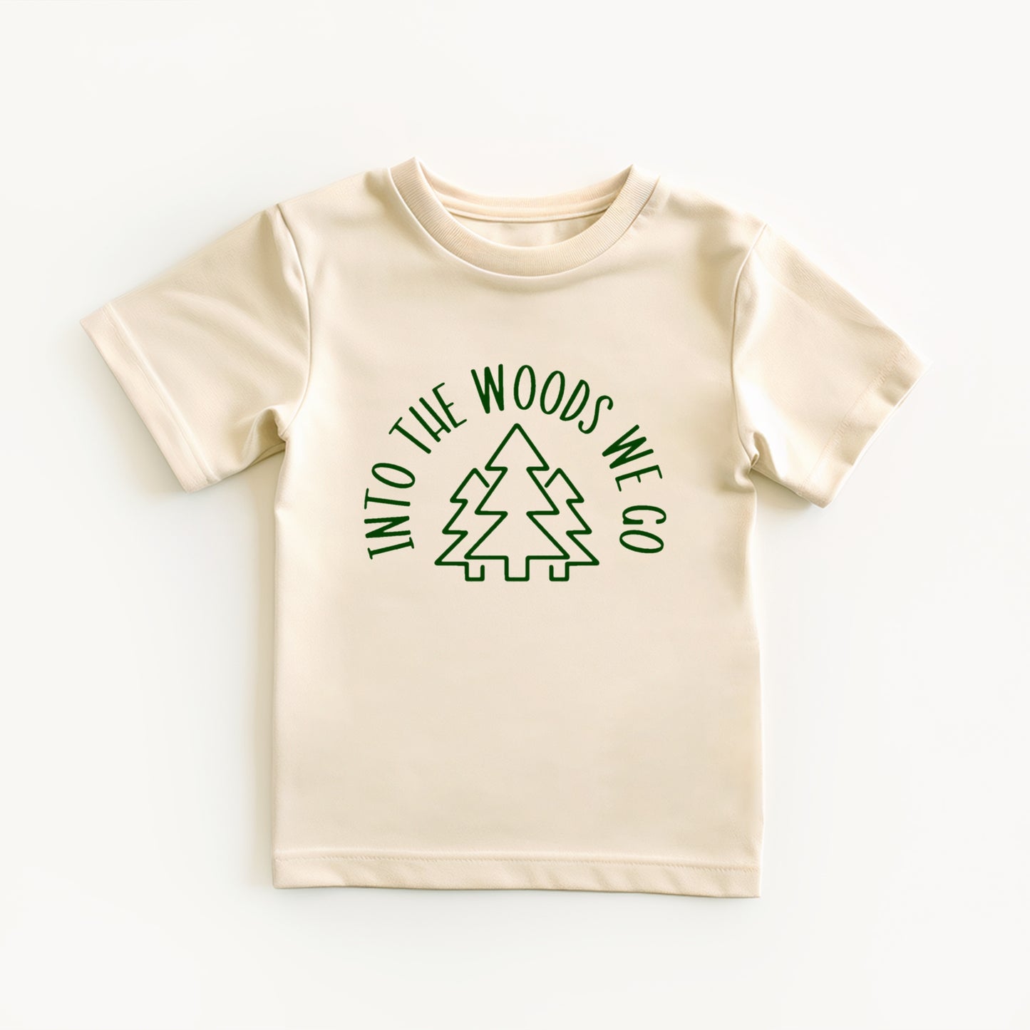 Beige t-shirt with green into the woods text and tree graphic on a white background