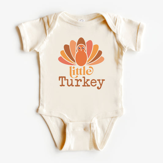 Baby onesie with 'little turkey' design on a white background