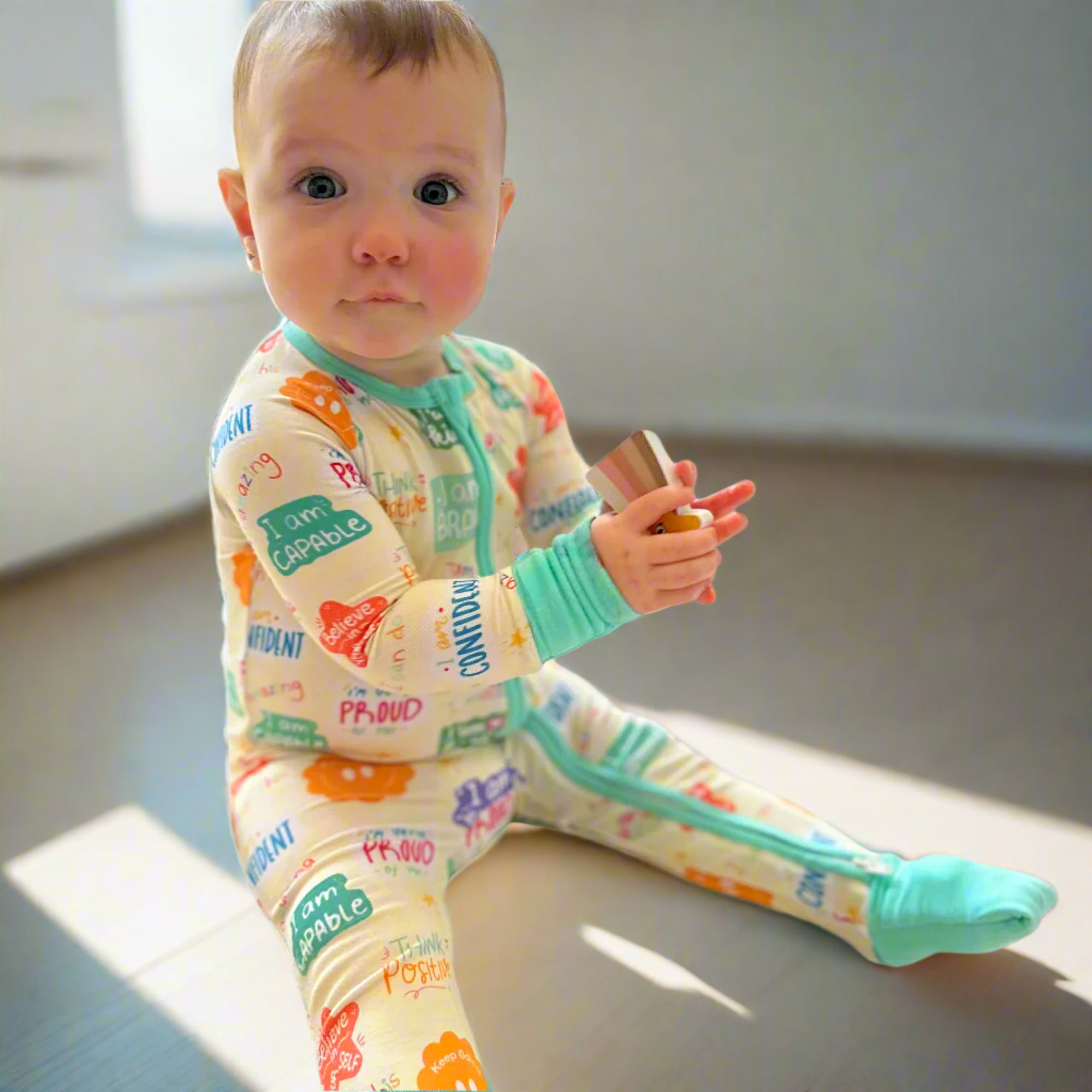 baby wearing affirmations colorful babmboo onesie