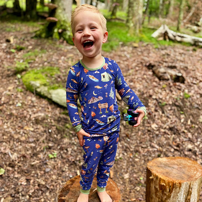 Child in Smoky Mountains camping pajamas in the forest