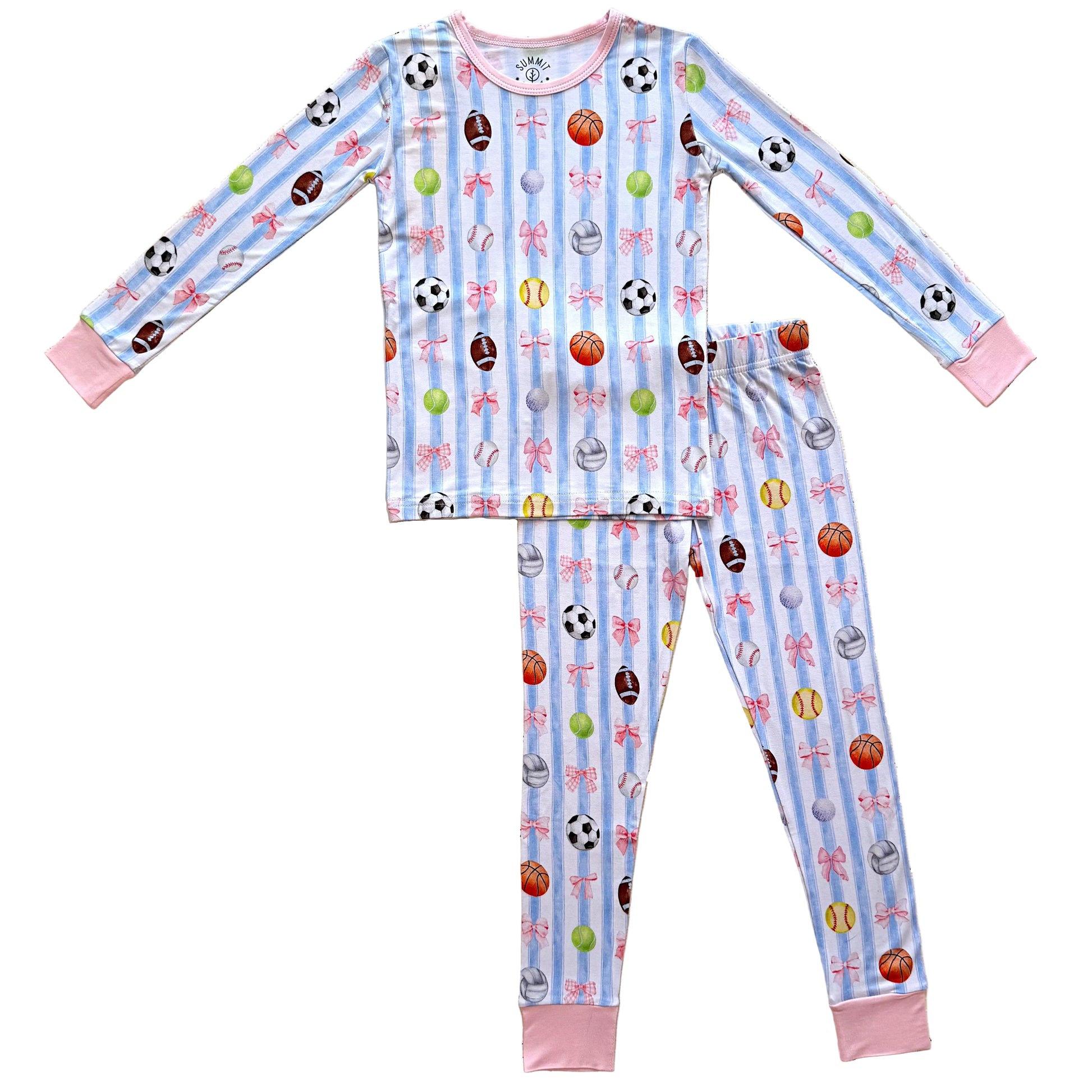 Children's pajama set with sports-themed pattern on a textured surface
