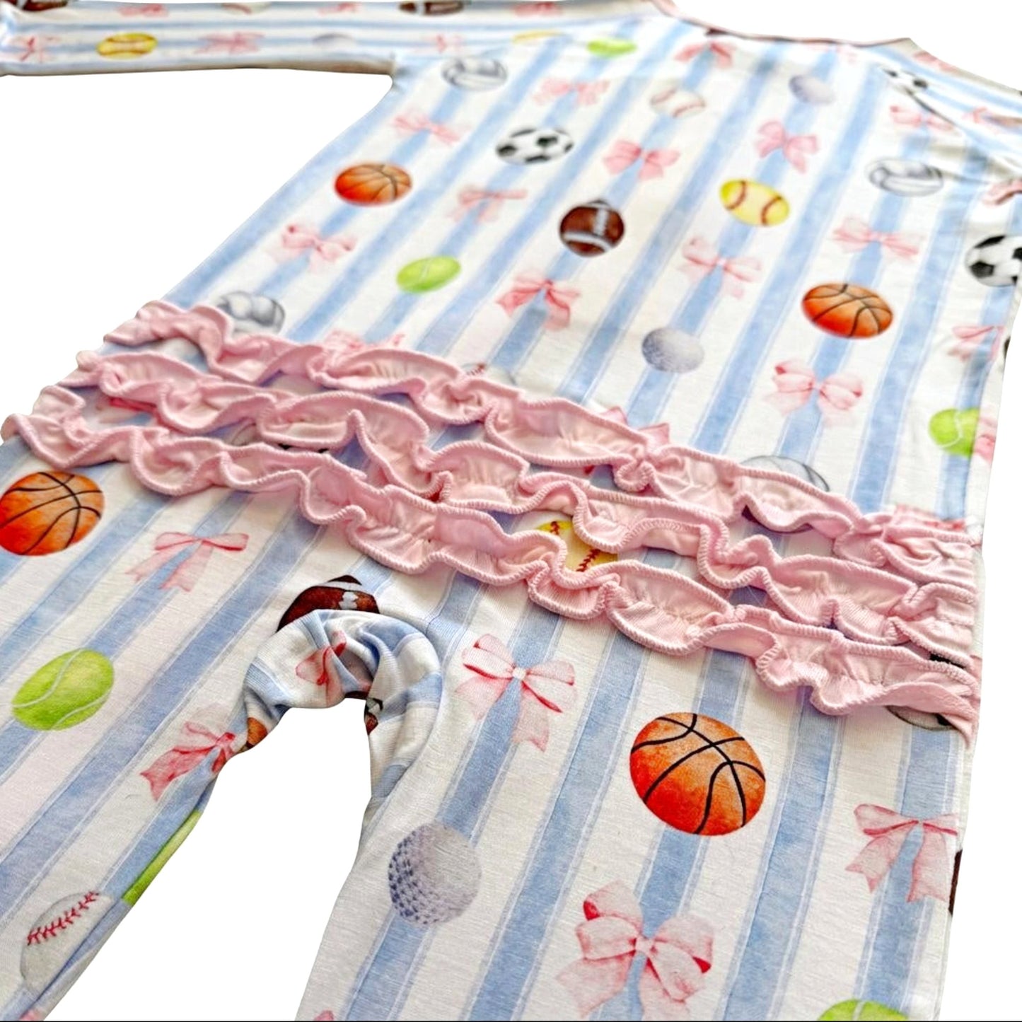 Children's bamboo pajamas with ruffles with sports-themed print on a striped fabric background