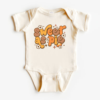 Baby onesie with 'Sweet as Pie' text on a white background
