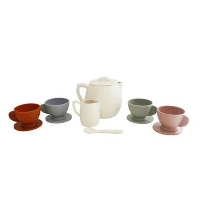 Set of colorful silicone tea cups and a teapot on a white background