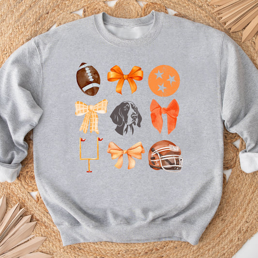 Gray sweatshirt with colorful graphic design on a woven mat