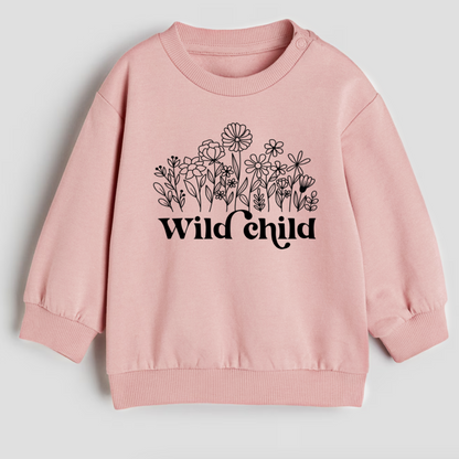 Pink sweatshirt with floral design and 'Wild Child' text on a light gray background